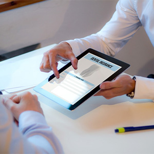 Patient reviewing dental insurance on tablet